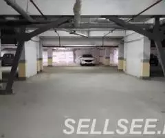 Продается машиноместо в паркинге на Дыбенко 22 - 3